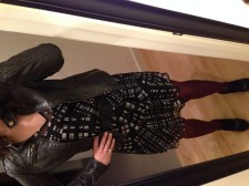 black and white dress, black leather jacket, maroon tights, black booties