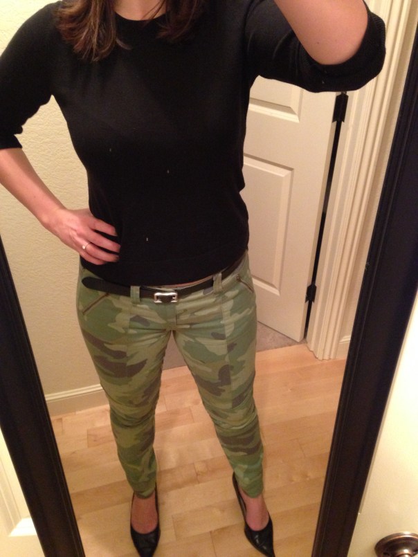 Black sweater, camo jeans
